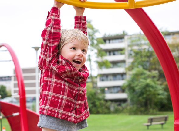 boy-hanging-at-playground